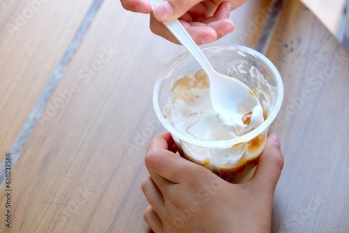 Εκτύπωση καμβά Little girl (child) eating ice cream on the street