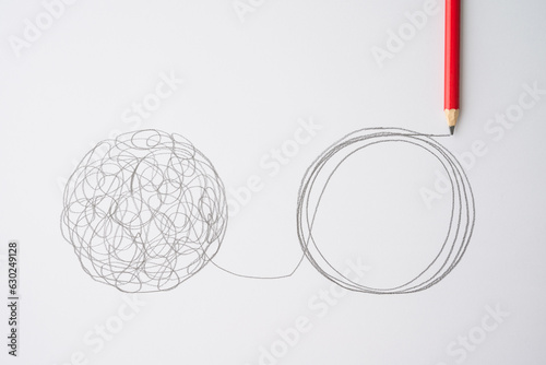 Flat lay of pencil hand drawing line chaos to order circle on paper background. Concept of abstract business management strategy, reorganize, problem solving solution, psychology mental health, logic.