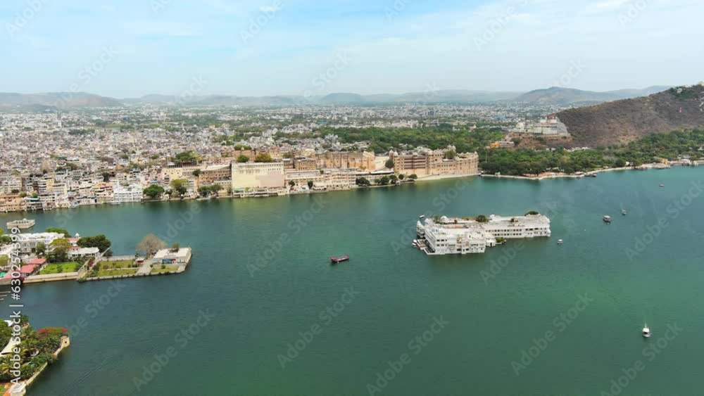 Udaipur, India: Aerial view of city in Rajasthan, famous City Palace of Udaipur and Lake Pichola - landscape panorama of South Asia from above Udaipur, India: Aerial view of city in Rajasthan, famous City Palace of Udaipur and Lake Pichola - landscape panorama of South Asia from above