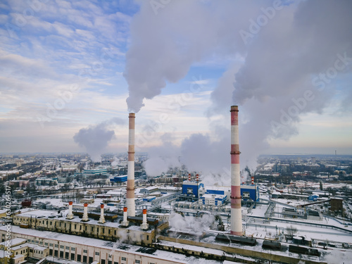 Industrial factory smokestack emission smoke from natural gas in atmosphere. Industry zone, factory smoke plumes. Global energy crisis