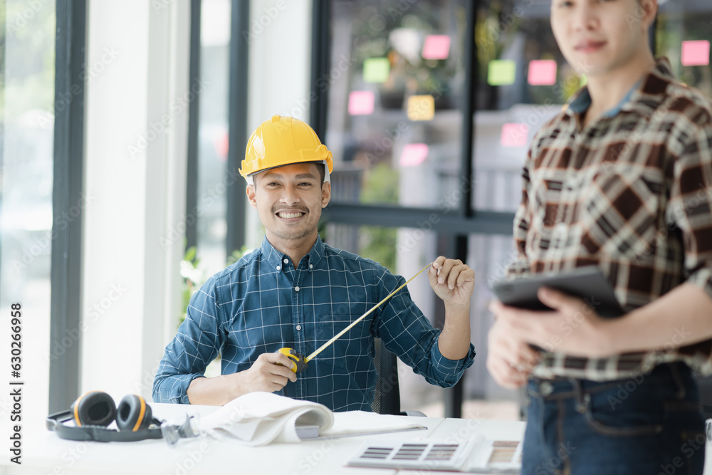 Asian engineer team and architects working designing planing of project, Home renovation concept. Asian engineer team and architects working designing planing of project, Home renovation concept.