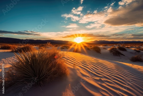 landscape of desert dunes at sunset with blue sky.  photo