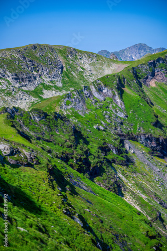 Summer landscape of the Fagaras Mountains, Romania. A view from the hiking trail near the Balea Lake and the Transfagarasan Road. photo