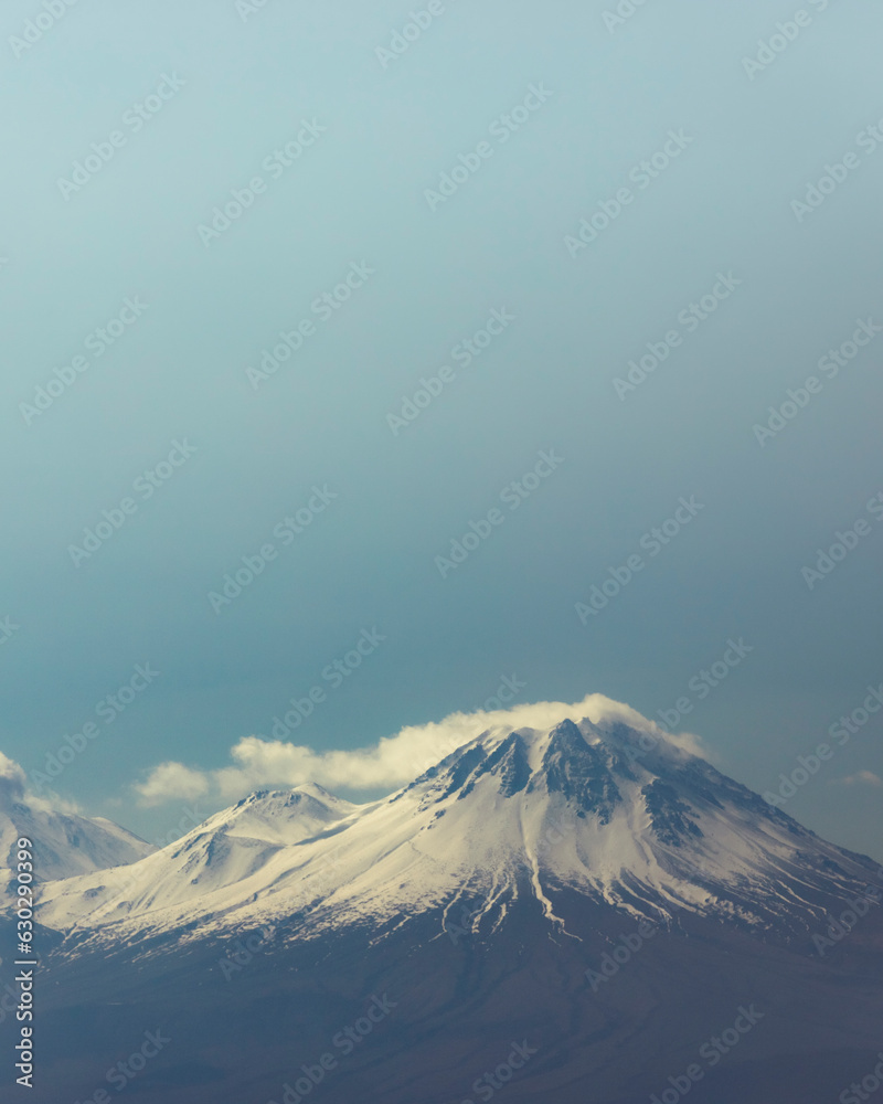 View of Mount Hasandagi, a Mountain Peak and inactive volcano with snow on the top in wintertime, Aksaray, Turkey. View of Mount Hasandagi, a Mountain Peak and inactive volcano with snow on the top in wintertime, Aksaray, Turkey.