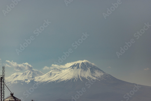 View of Mount Hasandagi, a Mountain Peak and inactive volcano with snow on the top in wintertime, Aksaray, Turkey. photo