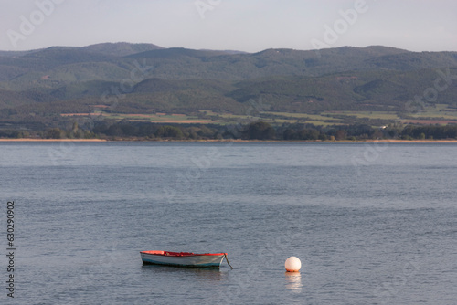 View of a fishing boat along Volvi Lake in Mikri Volvi small town, Central Macedonia, Greece. photo