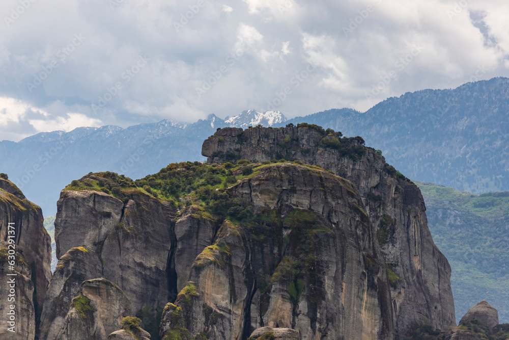 View of unique and enormous columns of rock rising precipitously from the ground in Meteora region, Trikala, Thessaly, Greece. View of unique and enormous columns of rock rising precipitously from the ground in Meteora region, Trikala, Thessaly, Greece.