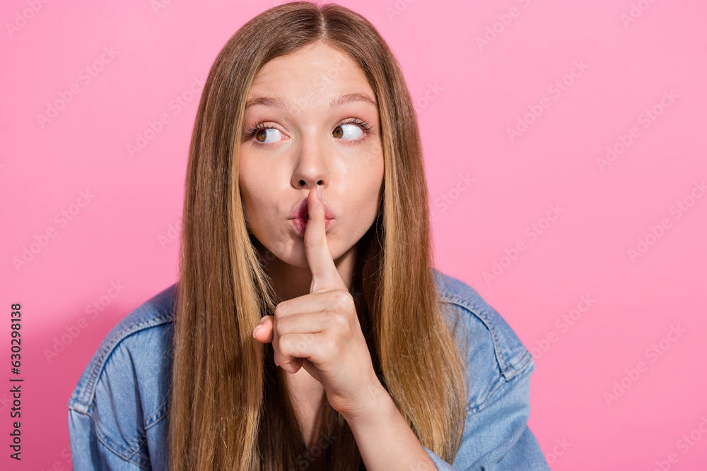 Photo portrait of lovely teen young lady keep secret look empty space dressed stylish denim garment isolated on pink color background Photo portrait of lovely teen young lady keep secret look empty space dressed stylish denim garment isolated on pink color background