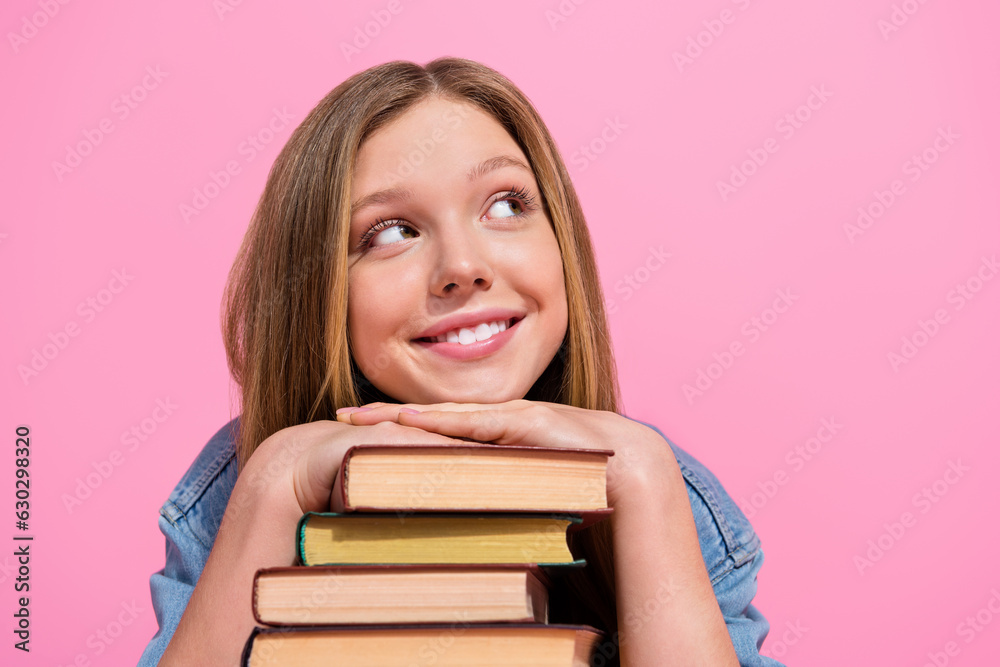 Close up photo of lovely positive lady wear trendy clothes hands under chin look up empty space offer isolated on pink color background Close up photo of lovely positive lady wear trendy clothes hands under chin look up empty space offer isolated on pink color background