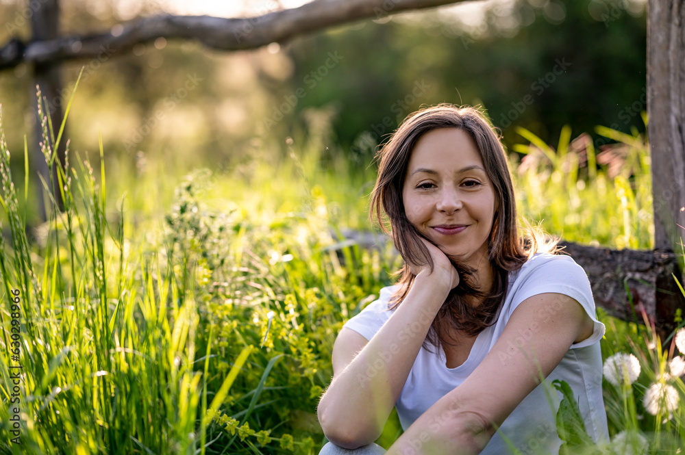 Beautiful woman enjoy the green nature and sunset Beautiful woman enjoy the green nature and sunset