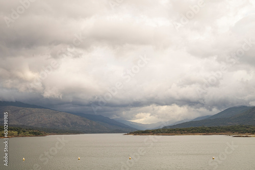 Beautiful panorama of Jerte valley from the reservoir of the city of Plasencia, with a very cloudy stormy sky, Extremadura photo