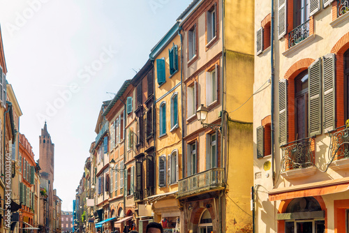 Facade or exterior of historic traditional houses in red or orange in the old city of Toulouse  France
