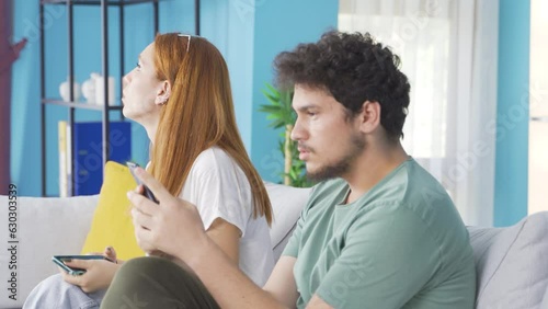 The couple who put down the phones are chatting. Phone addiction.