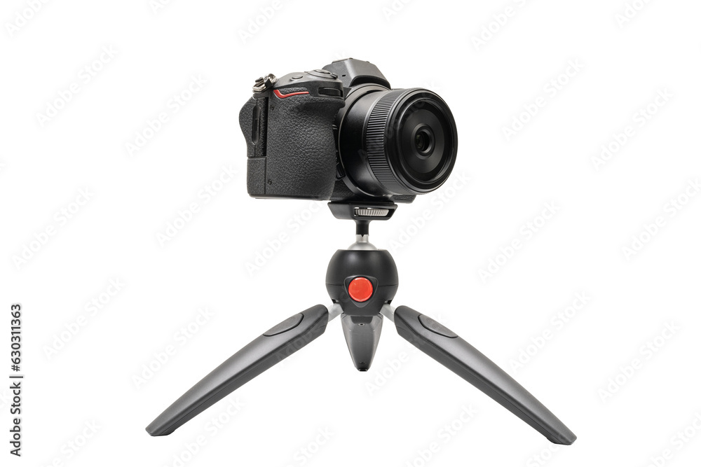 Mirrorless camera on a tripod for live or streaming, mockup camera isolated with clipping path on transparent background Mirrorless camera on a tripod for live or streaming, mockup camera isolated with clipping path on transparent background