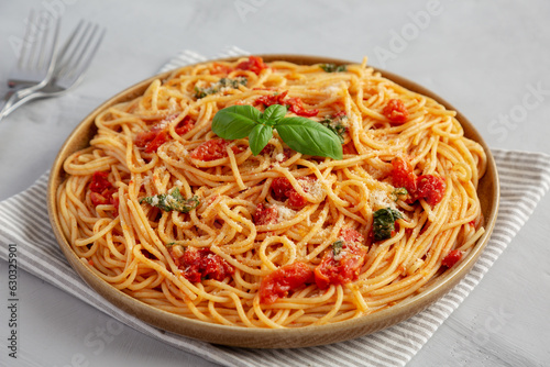 Homemade Spaghetti With Fresh Tomato Sauce on a Plate, side view.