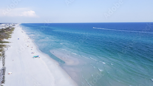 Miles of untouched beaches brilliantly white sand, crystal clear turquoise water with gorgeous shade of blue along upscale residential waterfront neighborhood in Santa Rosa, Florida, USA © trongnguyen