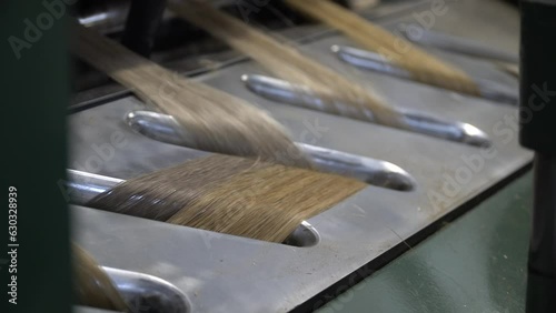 Linen production. Production process. Material processing plant. Creation of yarns and ropes. Industrial plant. A workshop with working machines. Close-up of production.