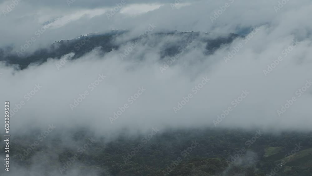 Mountain range with visible silhouettes through the morning blue fog. Mountain range with visible silhouettes through the morning blue fog.