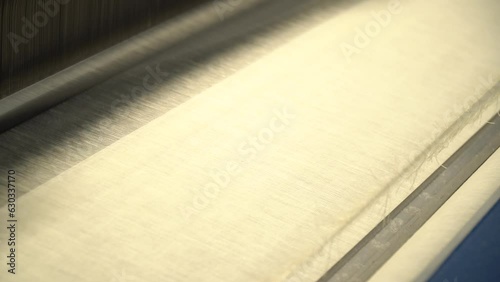 Linen production. Production process. Material processing plant. Creation of yarns and ropes. Industrial plant. A workshop with working machines. Close-up of production.
