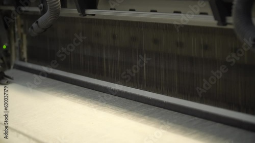 Linen production. Production process. Material processing plant. Creation of yarns and ropes. Industrial plant. A workshop with working machines. Close-up of production.