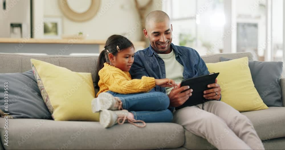 Tablet, high five and a man with his daughter on a sofa in the home living room for education or gaming. Kids, success and support with a man motivating his gamer girl child while sitting together Tablet, high five and a man with his daughter on a sofa in the home living room for education or gaming. Kids, success and support with a man motivating his gamer girl child while sitting together