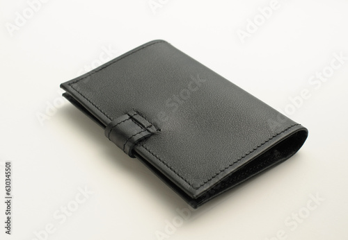 handmade leather black cover for auto documents from different sides isolated on white background