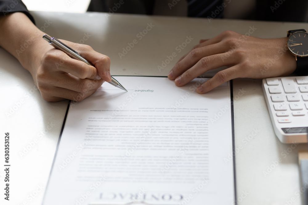 Businessman or real estate agent signs a contract to sell the house legally. Real estate consultant, legal agreement contract, rental, lease, mortgage. Businessman or real estate agent signs a contract to sell the house legally. Real estate consultant, legal agreement contract, rental, lease, mortgage.