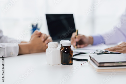 Doctor diagnosing a woman's illness in a hospital examination room, drug treatment from specialized doctors. General medical treatment and counseling for women's health.