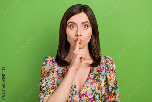 Photo of gorgeous person finger touch lips demonstrate shh gesture isolated on green color background