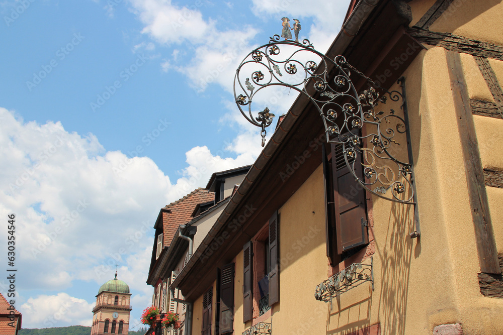 old sign and houses in kaysersberg in alsace (france)