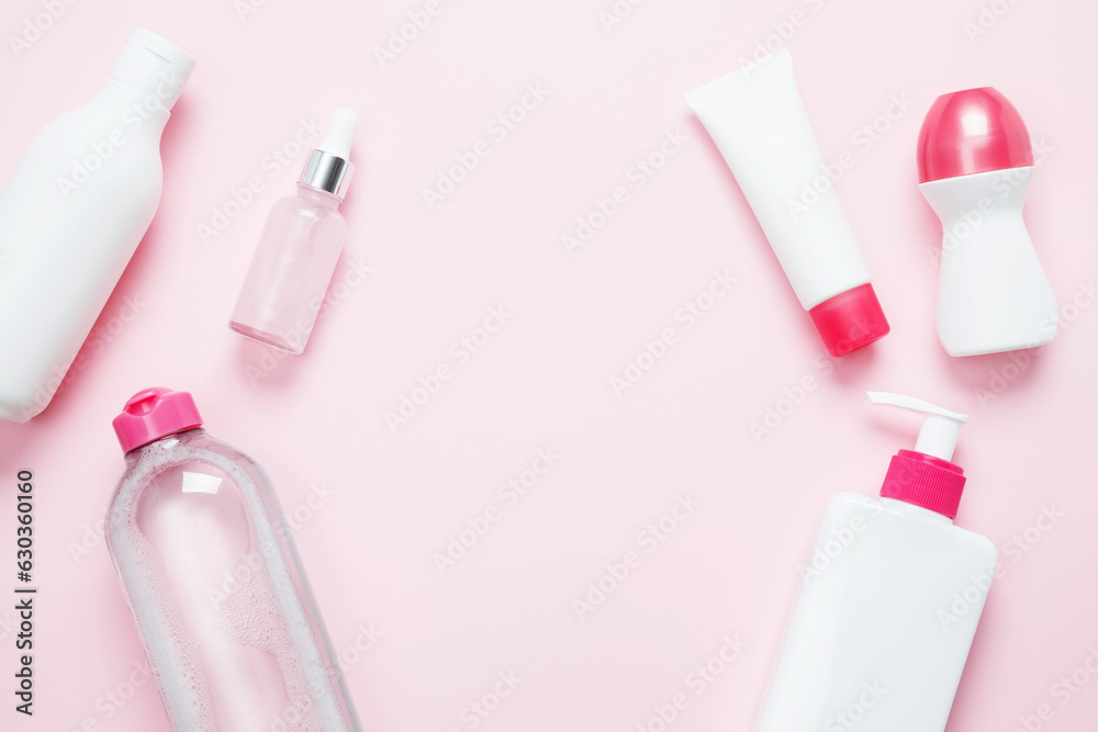 Cosmetic beauty products on pink background. Bottles and tubes with branding mock up. Skin care and beauty concept. Top view, flat lay, copy space Cosmetic beauty products on pink background. Bottles and tubes with branding mock up. Skin care and beauty concept. Top view, flat lay, copy space
