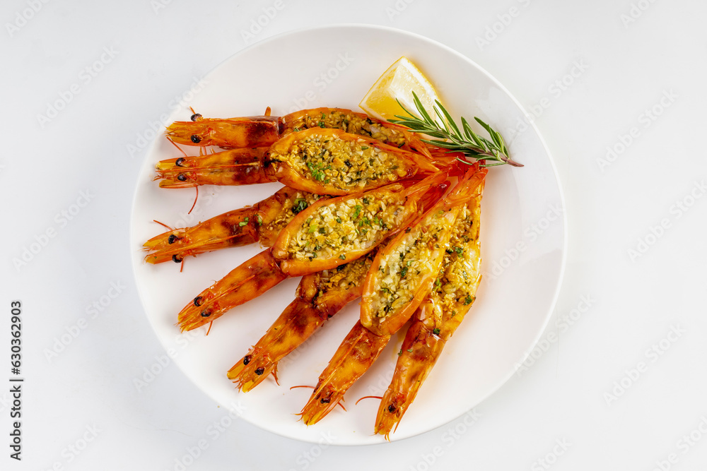 Grilled garlic butter prawns on white background Grilled garlic butter prawns on white background