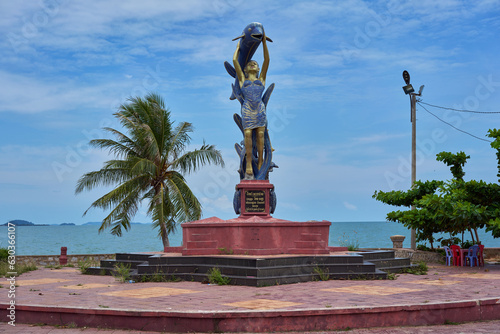 Statue of a lady and a fish in Kep, Cambodia