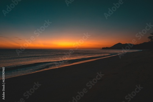 Beautiful sunset view of the ocean and mountain landscape