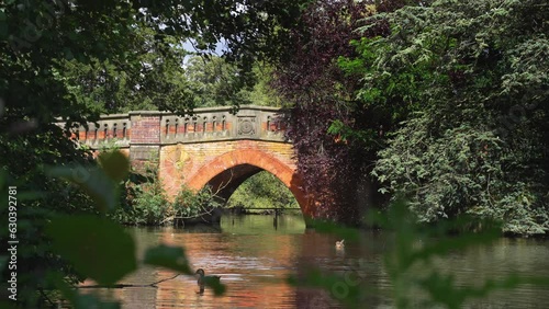 Bridge over the lake at Canon Hill Park, Birmingham.
Red brick bridge over Swan Lake, Canon Hill Park. photo