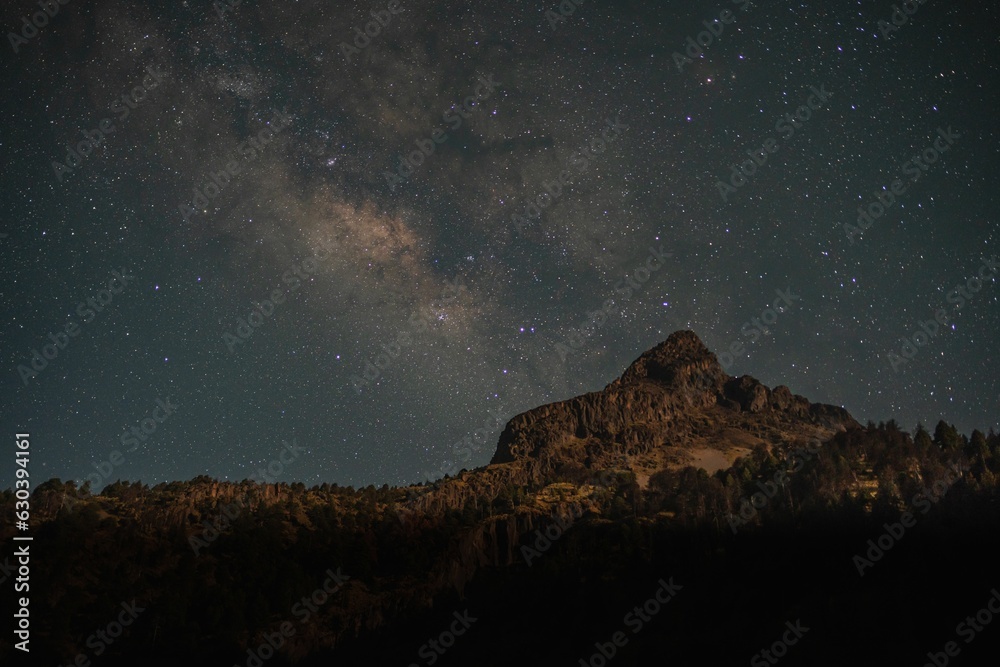 Our Galactic home rising over a volcanic peak