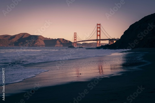 Stunning view of an isolated beach located beneath the renowned Golden Gate Bridge