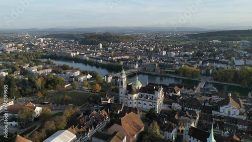 Aerial of the river passing through the beautiful solothurn town in Switzerland during the sunset