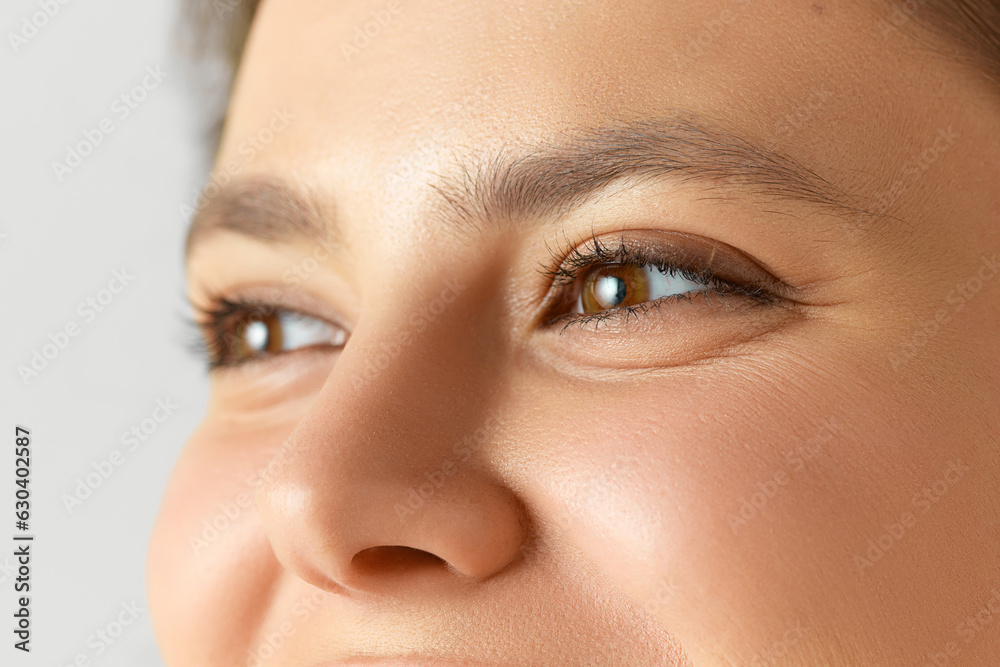 Close-up image of female face, eyes, nose. Woman with well-kept, smooth, glowing skin. Concept of natural beauty, cosmetology and dermatology, skincare, cosmetics, ad Close-up image of female face, eyes, nose. Woman with well-kept, smooth, glowing skin. Concept of natural beauty, cosmetology and dermatology, skincare, cosmetics, ad