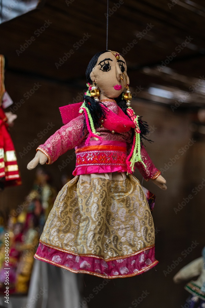 Close-up shot of a puppet doll in a traditional Punjabi suit