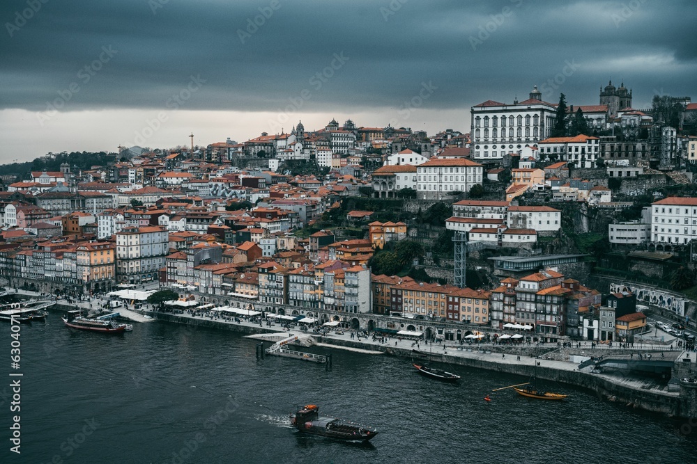 Aerial view of the bustling cityscape of Porto, Portugal in the evening