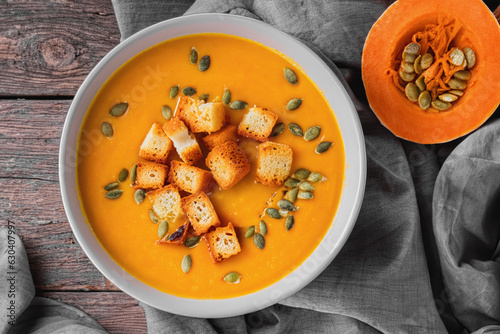 Bild auf Leinwand A delicious recipe for pumpkin cream soup with croutons