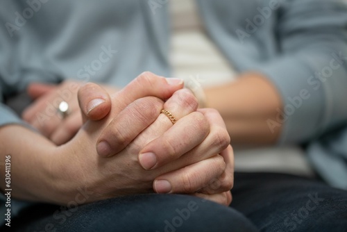 Loving couple holding hands during a teraphy session