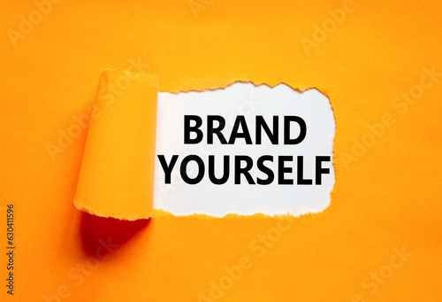 Brand yourself symbol. Concept words Brand yourself on beautiful white paper. Beautiful orange background. Business brand yourself concept. Copy space.