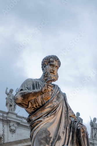 St Peter's Basilica in Vatican City, Rome, with a statue standing at the entrance