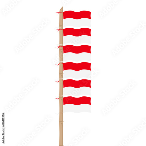 the red and white flag flutters on a bamboo pole
