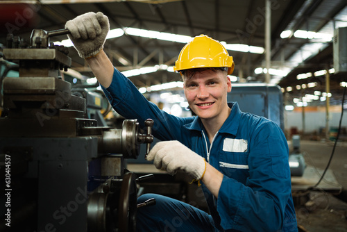 Heavy industry worker engineer wearing safety gear working in industrial factory background. steel plant industry