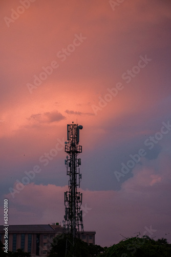 Mobile telecommunication tower Antenna and satellite dish with electronic communications equipment.