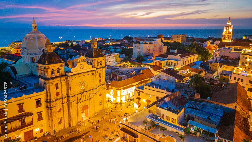 Fototapeta premium Cartagena, Colombia. Aerial View of Santuario de San Pedro Claver Church at Night, Traffic and Neighborhood, Drone 