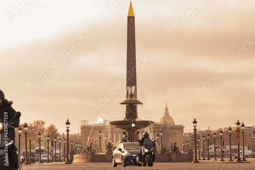 A compressed view of the Obelisque, the Assemblee Nationale and the Invalides with cars and a scooter photo